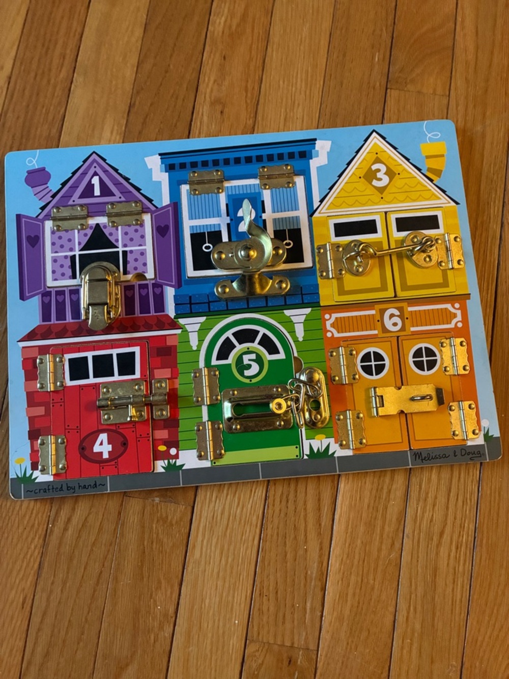 Melissa & Doug Latches Board (like new)